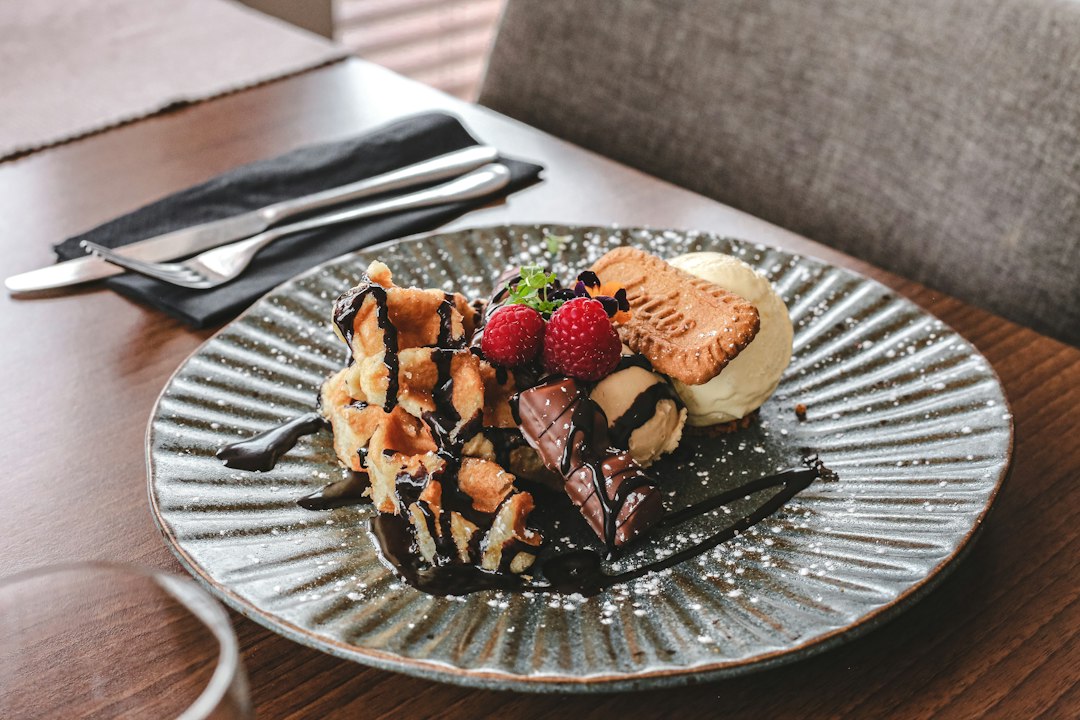 Representative plated dessert on a restaurant table, illustrating a sweet finish to dinner